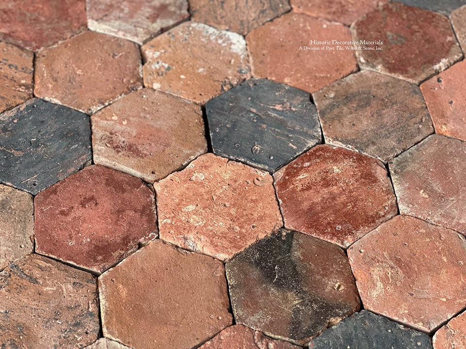 Recuperated antique French terra cotta tiles with hand marks, patina and antique edge details define authenticity.