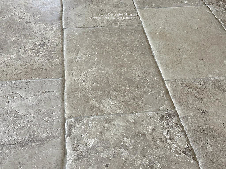 Brown and gray hues of antique French Limestone Floors add historic warmth to living spaces.