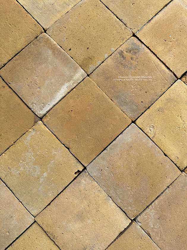 A matte surface patina on French reclaimed terra cotta tiles hints at the wear they received for 150-years.