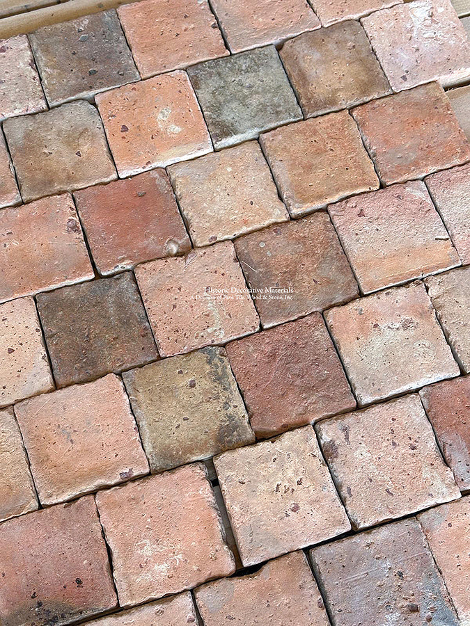 Installing French reclaimed terra cotta tile cobblestones in an offset joint pattern adds nuanced history to interiors.