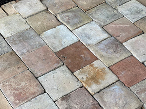 The beautiful color variations of French reclaimed terra cotta tile cobblestone are perfect for country French interior floors.