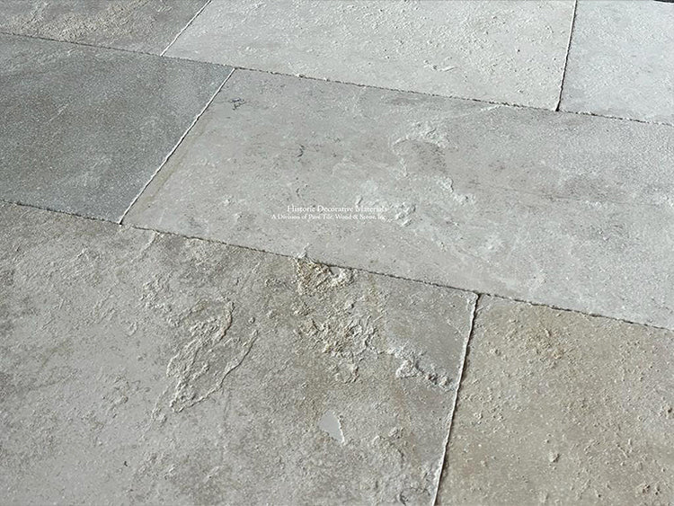 Soft gray blues, cream and olive colors of antique French limestone floors are lovely.