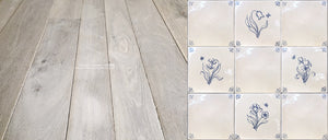 Antiqued Delft tiles harmonize historically with rendition reclaimed French oak flooring.