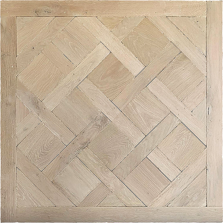Luxury interiors excel installing parquet de Versailles panels in hand-finished aged French white oak flooring. 