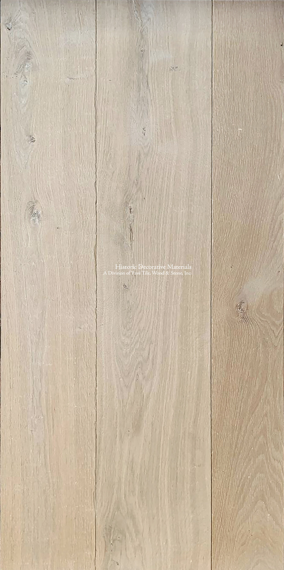 Wide plank and custom stair treads made from aged white French oak makes for a minimalist and historic interior.