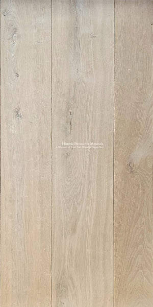 Wide plank and custom stair treads made from aged white French oak makes for a minimalist and historic interior.