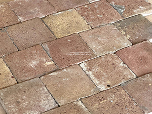 An old French reclaimed terra cotta tile floor will show rich patina.
