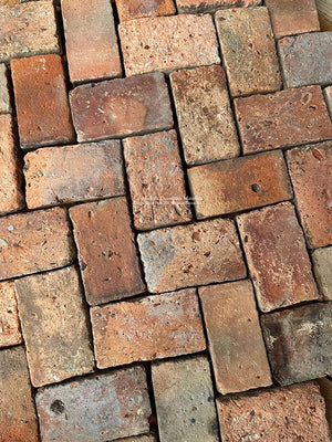 The herringbone pattern of Antique Terra Cotta Brick tiles holds the eye in kitchen floors.