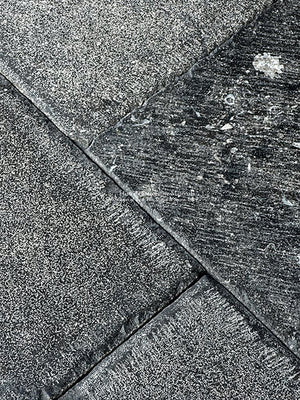 Hand-chiseled edge details and tight grout lines are hallmarks of our Antiqued Belgian Bluestone Floors.