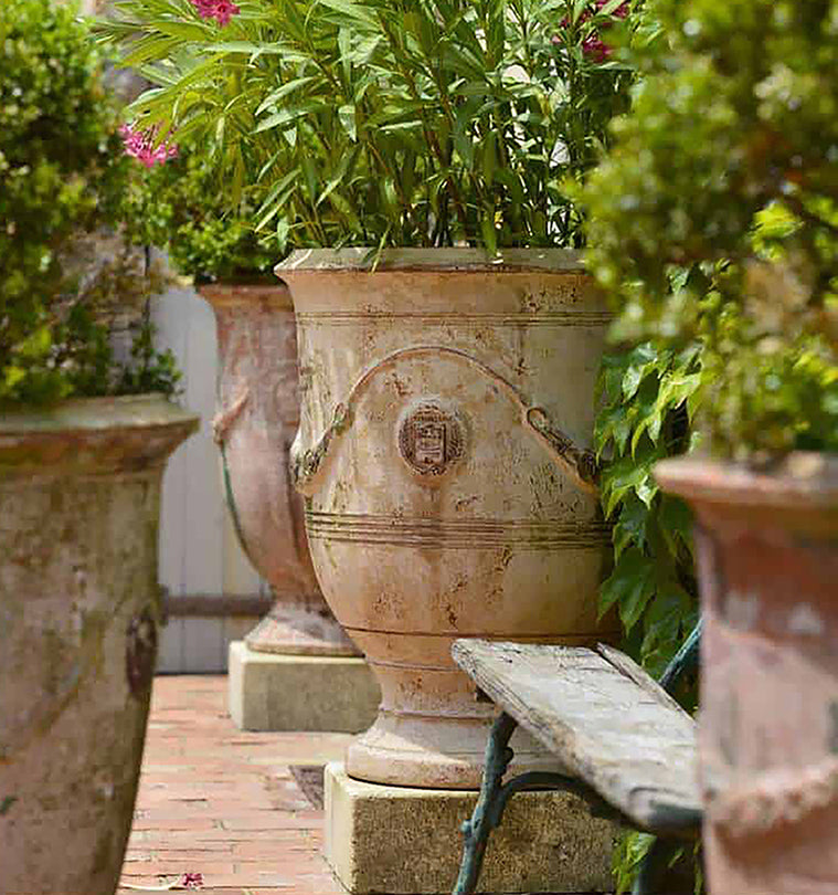 The matte patina of our vintage French pottery from Provence creates historic garden decor.