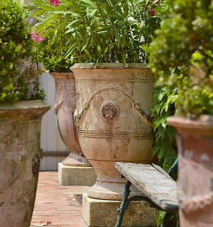 The matte patina of our vintage French pottery from Provence creates historic garden decor.