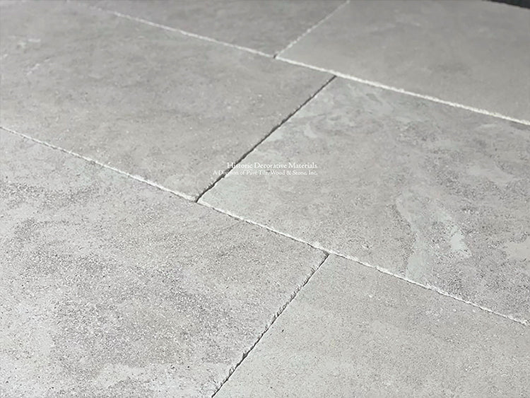 Soft gray colors are hallmarks of this antique French limestone floor.