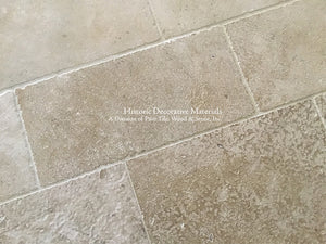 Warm ivory antique French limestone floors are soft neutrals for beautiful kitchens.