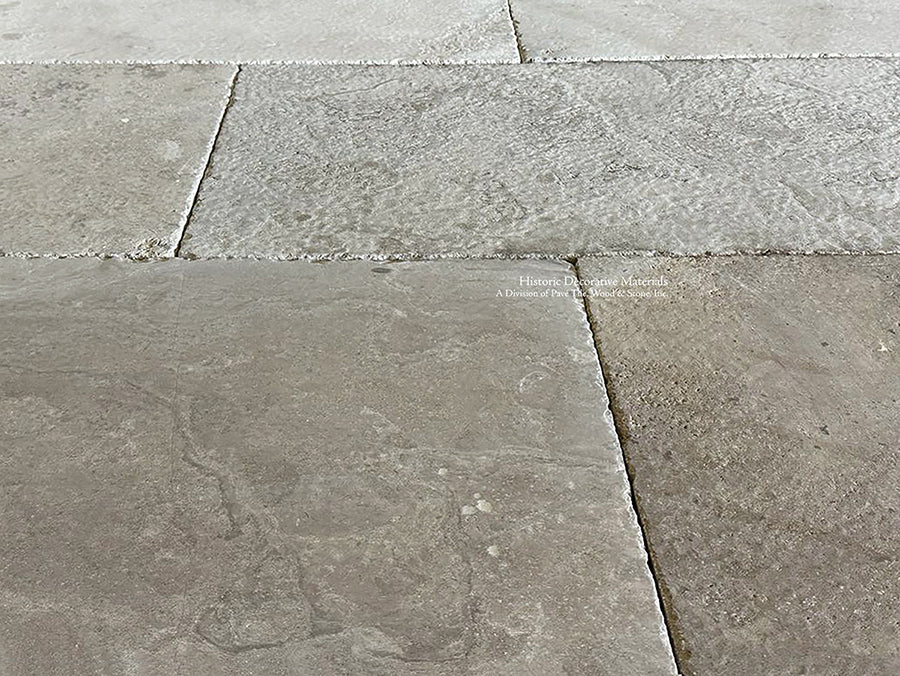 Large antique French limestone tiles create gorgeous scale in an interior.