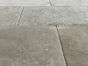 Large antique French limestone tiles create gorgeous scale in an interior.