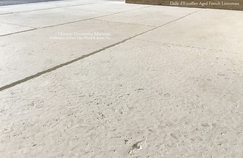 Subtle patina of antique French limestone floors  adds just the right texture for historically elegant interiors.