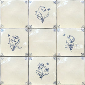 Oxtail corners are hallmarks of an antique Delft tile installation.