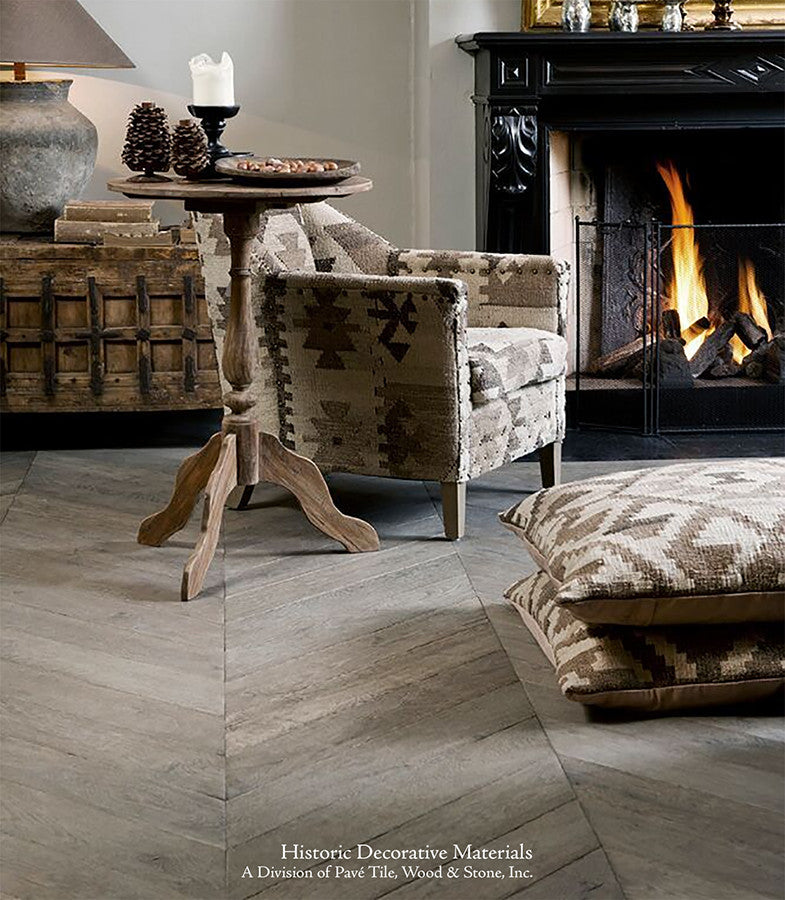 Reclaimed in texture and color, our aged French oak floors in chevron pattern beautifies an historic interior. 